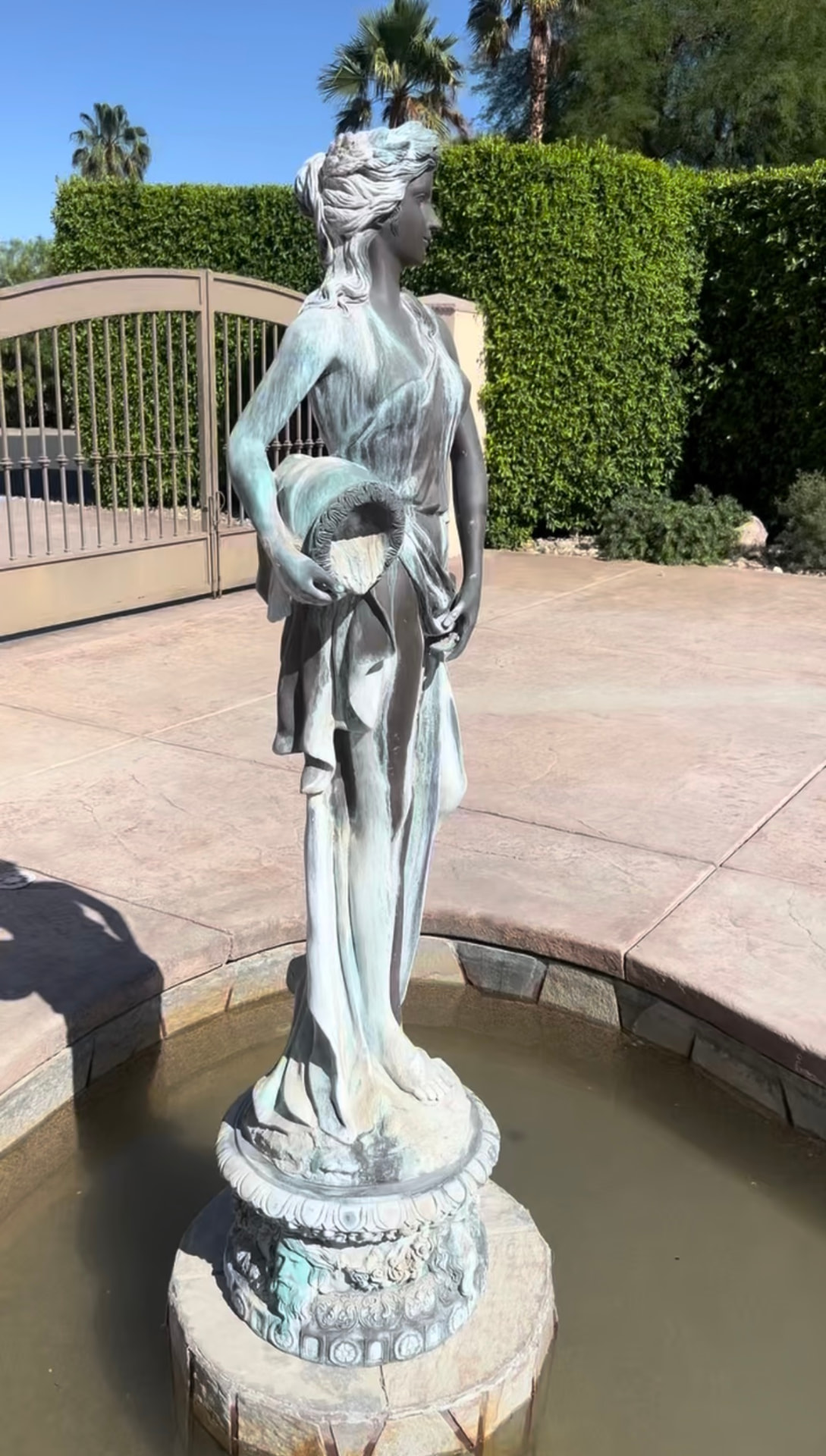 Bronze fountain sculpture covered in verdigris before restoration in Rancho Mirage